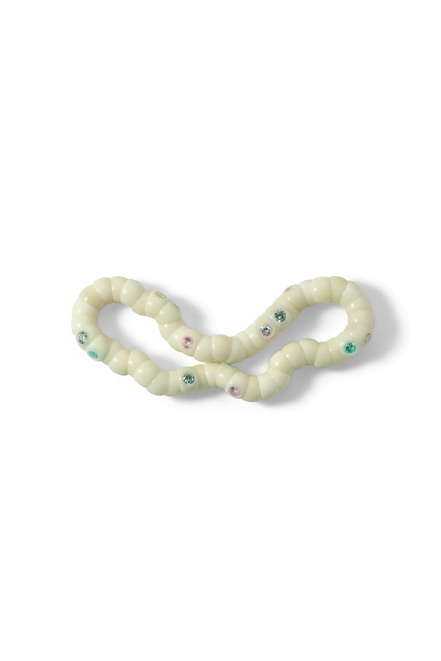 White dog toy with colorful beads on a white background