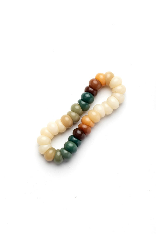 Multicolored beaded bracelet on a white background